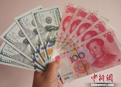 人民幣和美元資料圖。<a target='_blank' href='/' >中新網(wǎng)</a>記者 李金磊 攝