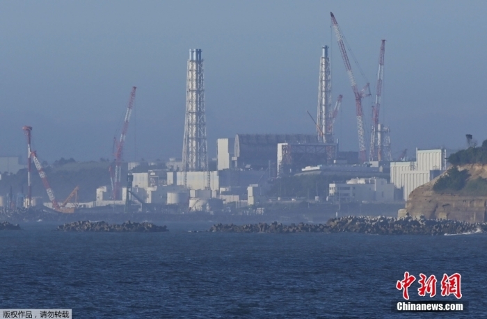 8月24日，從日本福島縣浪江町遠眺因海嘯受損的福島第一核電站。北京時間8月24日12時左右，日本正式開始排放福島第一核電站的核污染水。